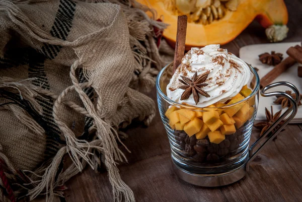 Pumpkin latte with whipped cream and spices
