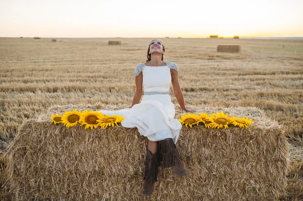 Happy woman in sunflower field