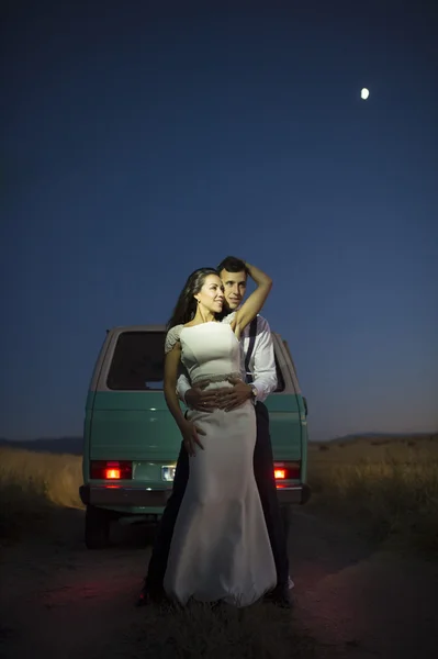 A newlywed couple is in love with a retro minivan