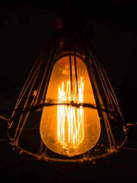 Light bulb and lamp in vintage style. Warm tone light bulb lamp. Lamps in coffee shop.