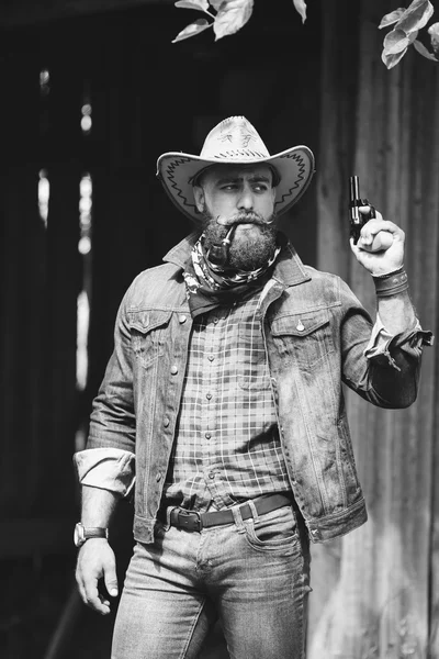 Bearded cowboy with gun