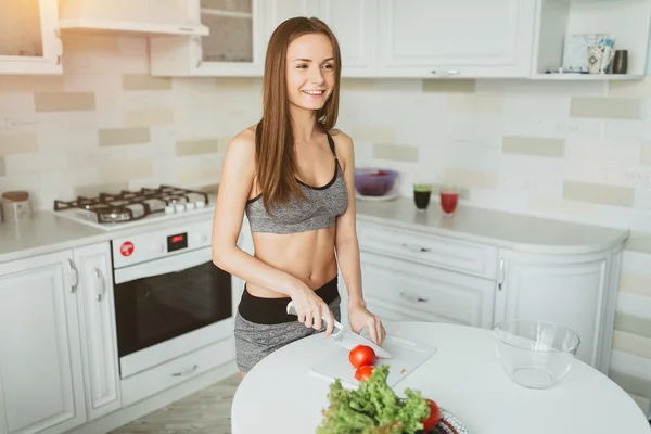 Young girl making salad