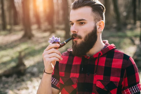 Bearded man smoking pipe