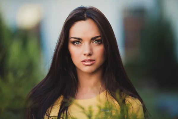 Young woman in yellow dress