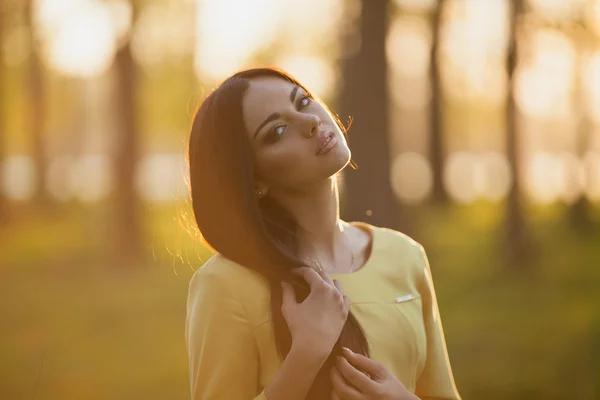 Young woman in evening sunlight