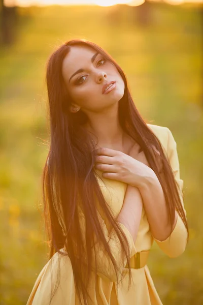 Young woman in evening sunlight