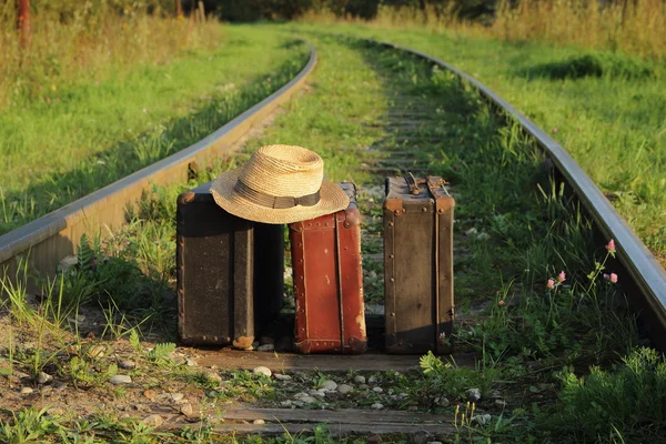 Suitcases old  on railway tracks