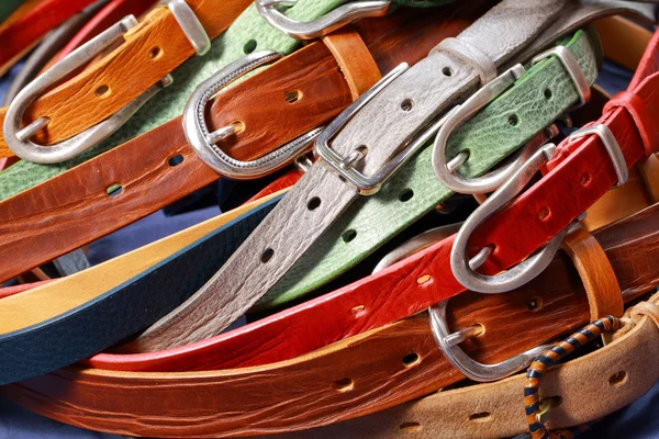 Pile of colorful leather belts