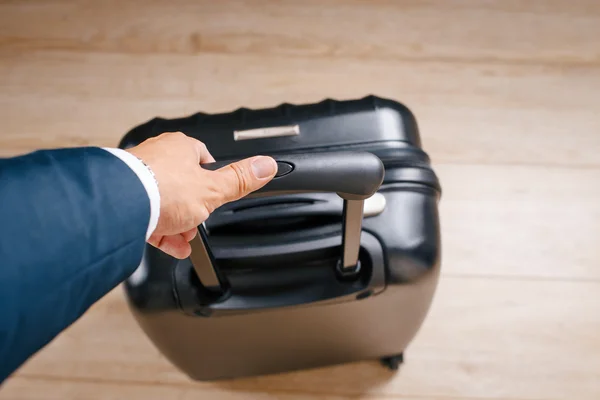 Businessman packed up and sent on a business trip with suitcase in another country