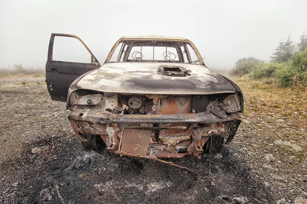 Front view of a burnt out car