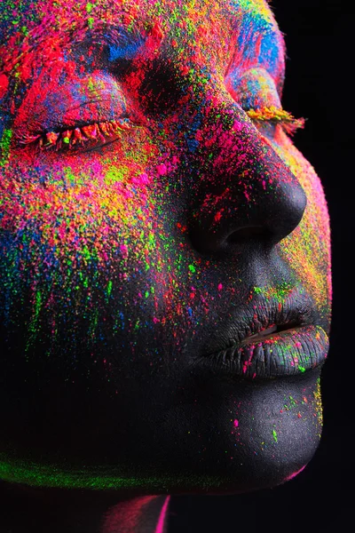 Girl with a black body-art and a colorful makeup