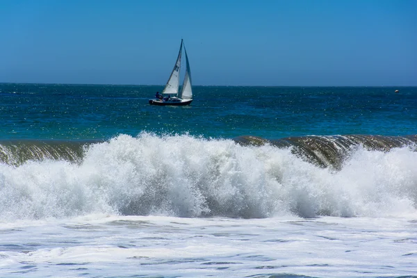 Sailing Boat with Pacific Huge Wave