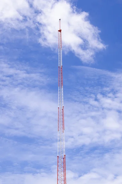 Lightning rod antenna repeater tower on blue sky