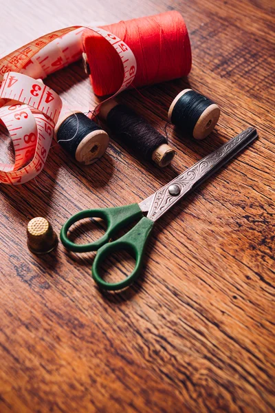 Tailor the tool to measure  length, scissors, spools of colored