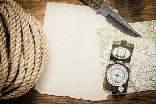 Plan trips - paper, table, compass, map, knife