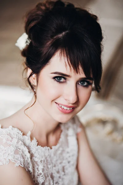 Beautiful woman posing in a wedding dress. wedding makeup and hairstyle, fashion bride model jewelry and beauty female face, bride in luxury wedding dress,