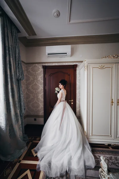 Wedding portrait of the bride in a white dress