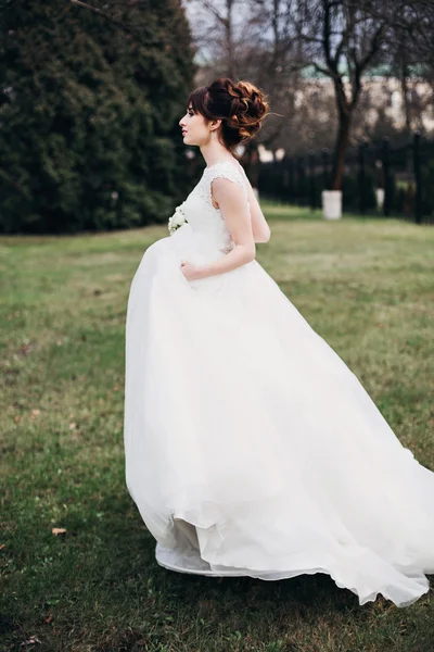 Wedding bride smiling. Portrait of the bride -bride in an expensive wedding dress.Attractive girl.Beautiful bride. Portrait of the bride with big eyes