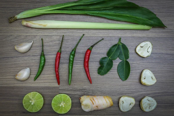 Fresh herbs and spices on wooden background, Ingredients of Thai spicy food, Ingredients of Tom yum, Still life photography with ingredients, The art of food photography with the ingredients