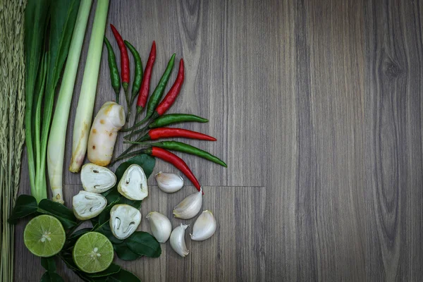 Fresh herbs and spices on wooden background, Ingredients of Thai spicy food, Ingredients of Tom yum, Still life photography with ingredients, The art of food photography with the ingredients