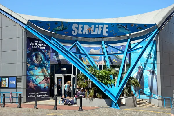 Front entrance to the National Sea Life Centre with a party of school children waiting to enter, Birmingham.