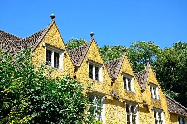 Cotswold cottage with dormer windows in the village centre, Castle Combe.