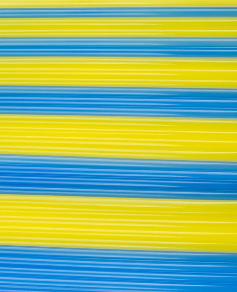 Texture yellow end bluecocktail sticks. yellow and blue horizont