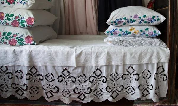 Old style bedding on a bed