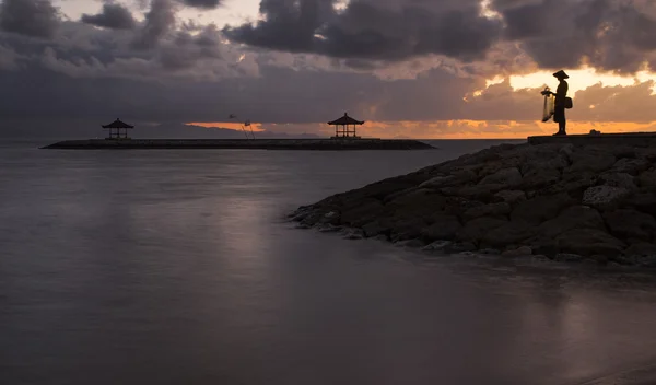 Traditional Balinese fisherman at sunrise