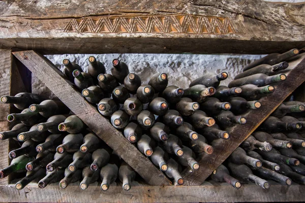 Old wine bottles in a wine cellar