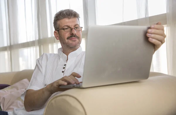 Middle aged man and computer