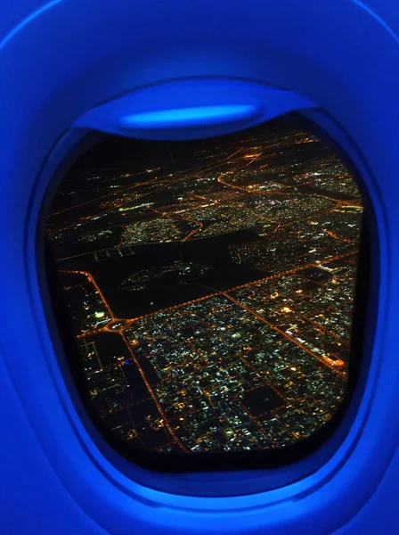 the view from the plane to the lights of the night city.