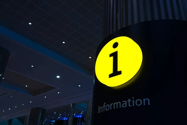 Glowing yellow sign Information desk. Reference Information. Help box.