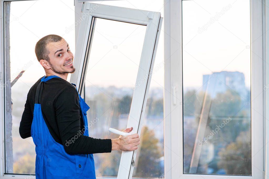 Professional master at repair and installation of windows, at work.