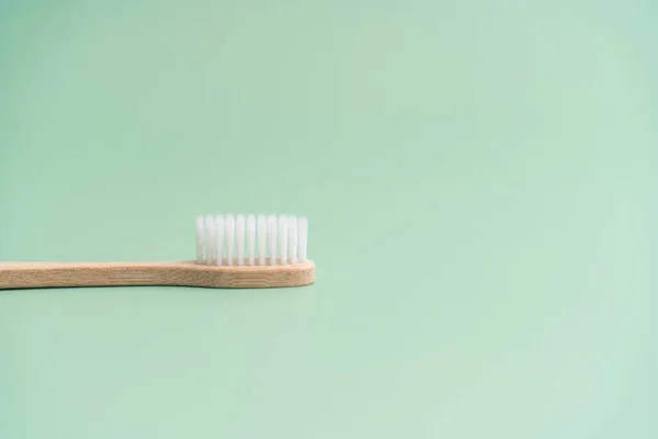 Environmentally Friendly Bamboo Wood Antibacterial Toothbrush Light Green Background — Stock Photo, Image