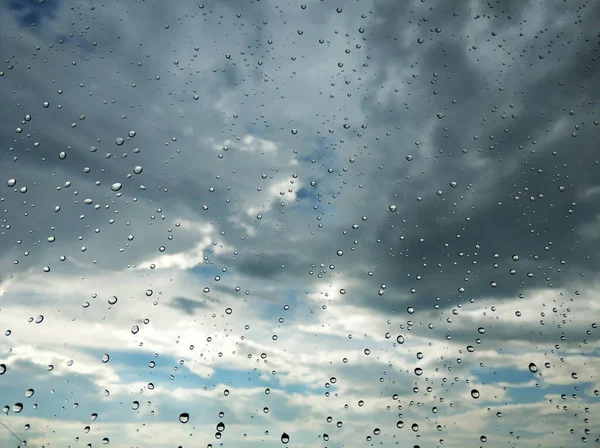 Raindrops on glass. Rainy weather. sad day. Dark sky.