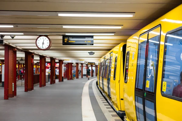 Modern subway. Yellow train at the station.