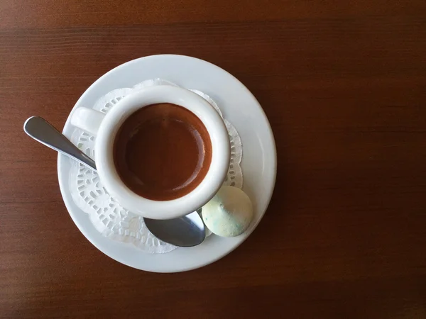 White cup of coffee on the wooden table — Stock Photo, Image