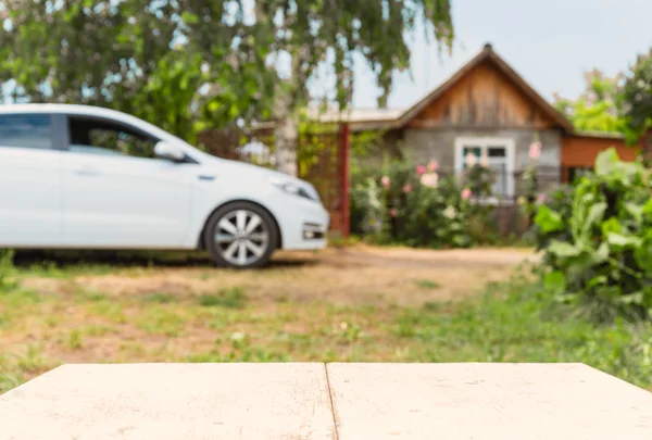 Car and house in perspective background — Stock Photo, Image