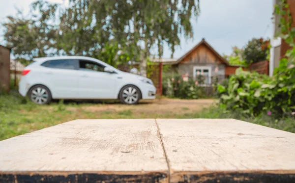 Carro e casa em perspectiva de fundo — Fotografia de Stock