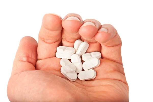 Tabletki w ręku — Zdjęcie stockowe