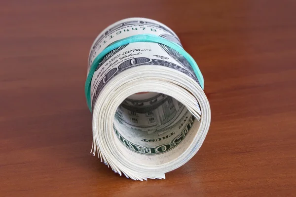 Pilha de dólares em dinheiro — Fotografia de Stock