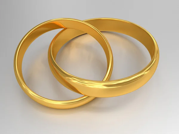 Anéis de casamento de ouro conectados — Fotografia de Stock