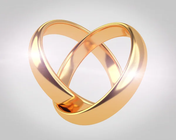 Heart with wedding rings — Stock Photo, Image