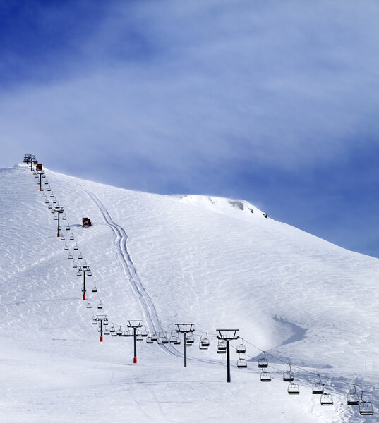 Ski slope and chair-lift at morning