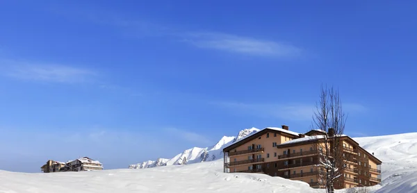 Panoramic view on hotels in winter mountains Stock Image