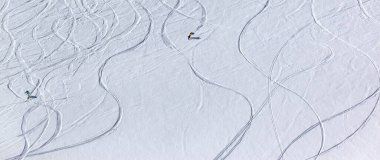 Snowboarders downhill on off piste slope. Caucasus Mountains, Georgia, region Gudauri. Panoramic view. clipart