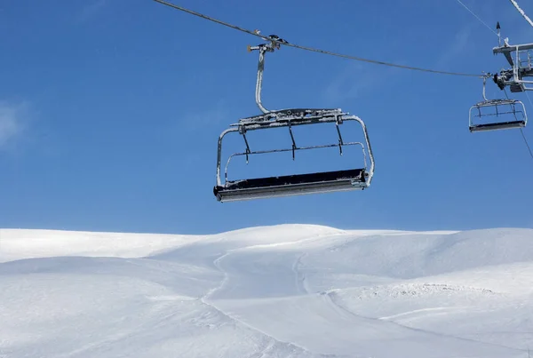 Ski Slope Chair Lift Ski Resort Blue Sky Falling Snow — Stock fotografie