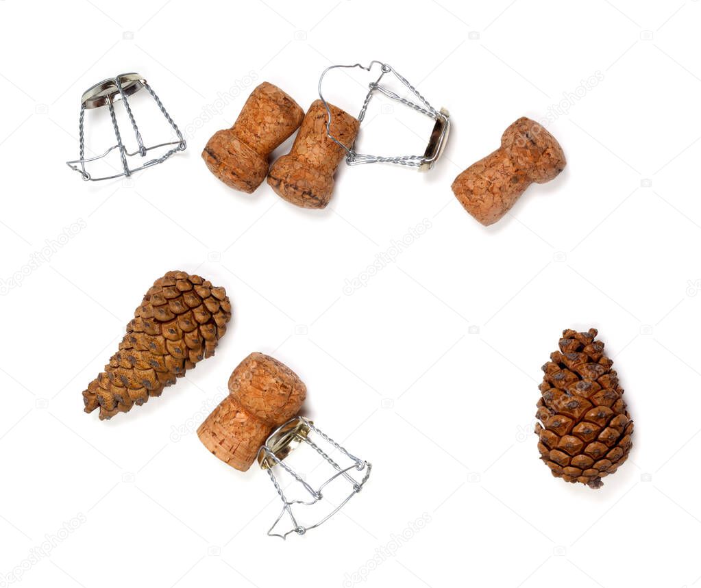 Fir cones and champagne wine corks with muselet. Isolated on white background. View from above. 