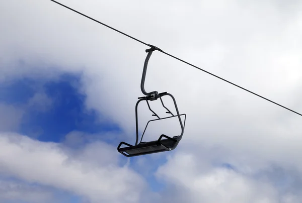 Chair-lift and cloudy sky — Stock Photo, Image